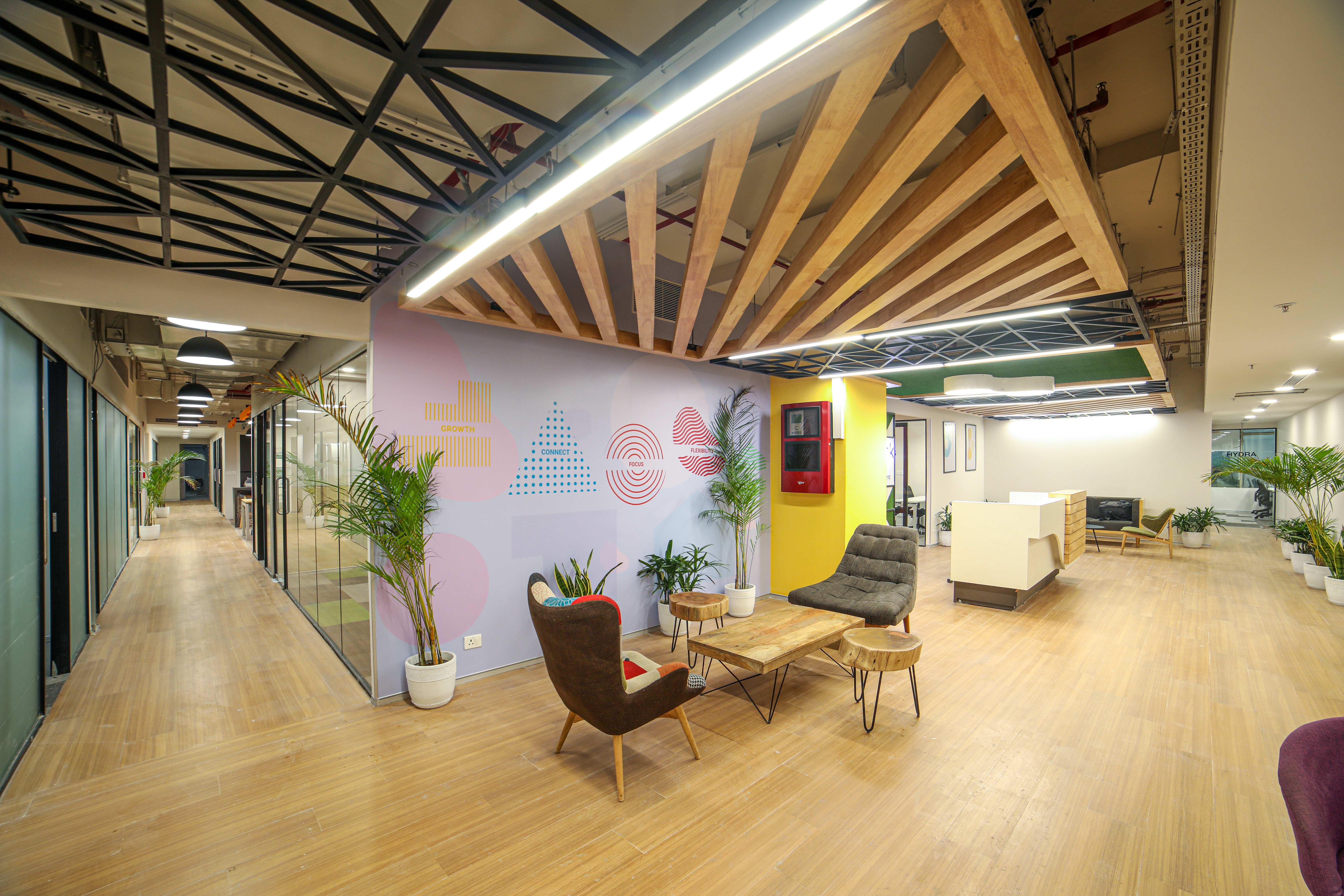A spacious office with a colourful wall